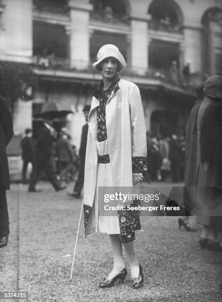 Matching dress and coat, with embroidered panels around the hem, cuffs and front.