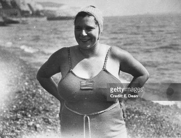 Eva Morrison from Boston, USA on the shore at Dover. She hopes to swim the channel and is being trained by Mr Cole a Dover pilot. She failed in her...