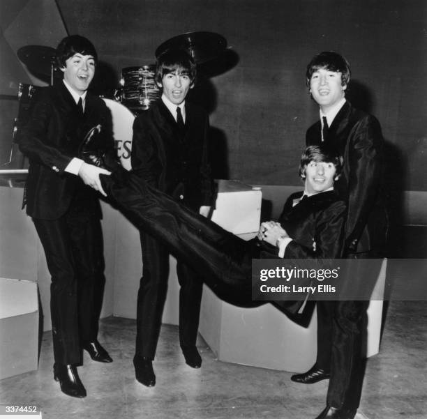 Ringo Starr being given the bumps by the other members of popular rock group The Beatles on his 24th birthday. From left to right, Paul McCartney,...