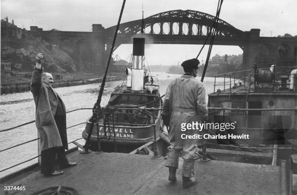 Coal miner Harry Wilkins waves goodbye to his home town of Sunderland as he sails to Copenhagen in the 'Kentucky', the first coal-ship leaving...