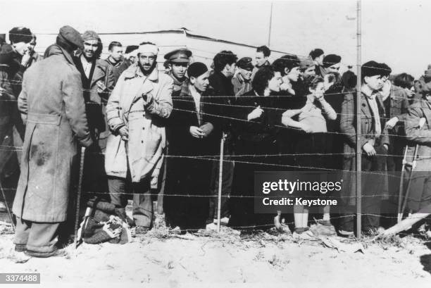 Civilians and soldiers at a refugeee camp in Le Perthus, France, on the border with Spain, during the Spanish Civil War.