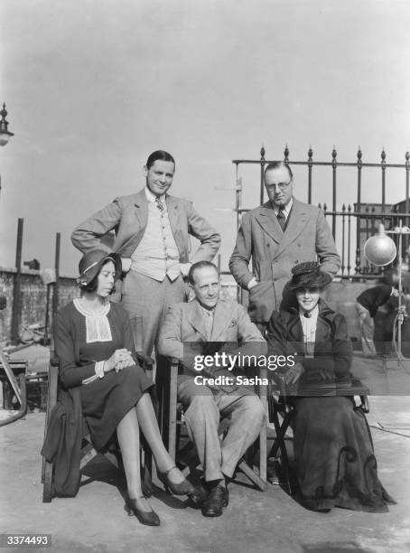 At Islington Studios, London, during the filming of A A Milne's play 'Michael and Mary' are actor Herbert Marshall and director Victor Saville ....