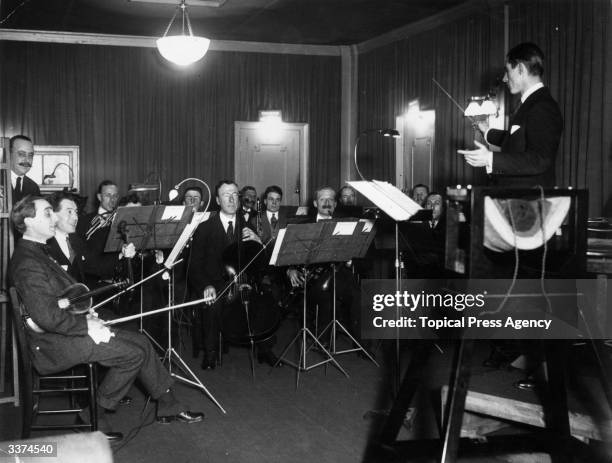 The 'Invisible Band' records music for BBC Radio at their Savoy Hill Studios in London.