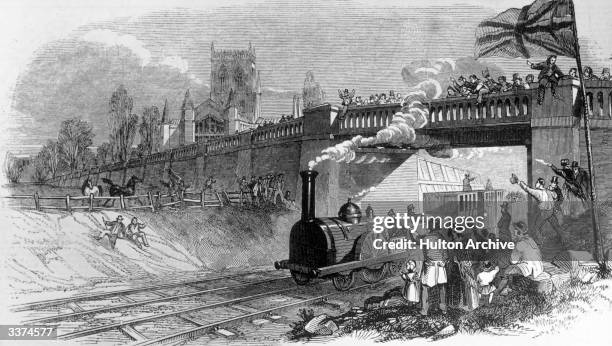 Spectators cheer the first locomotive passing the Great Grimsby church on the Manchester, Sheffield and Lincolnshire railway.