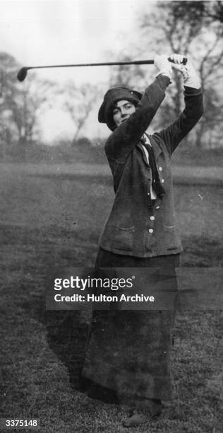 Mrs Winston Churchill playing golf at Ranelagh in a Ladies Parliamentary golf match.