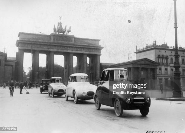 Pioneering experimental streamlined car with bodywork designed by Hungarian-born German aerodynamicist Paul Jaray being driven around the streets of...