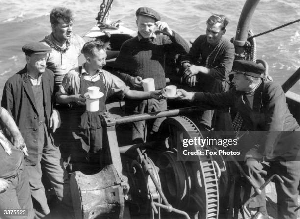 The crew of the London based tug 'Sunvill' one of the many small craft which took part in the evacuation of British and allied troops from Dunkirk.