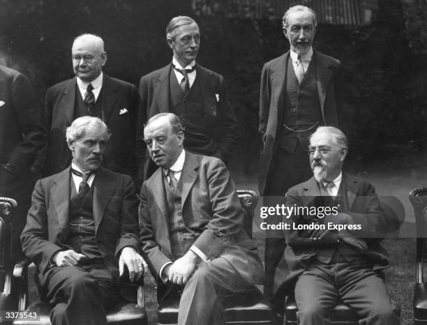 The Labour Cabinet at 10 Downing Street in London. Back row left to right - Tom Shaw, Arthur Greenwood and Noel Buxton. Front row left to right -...