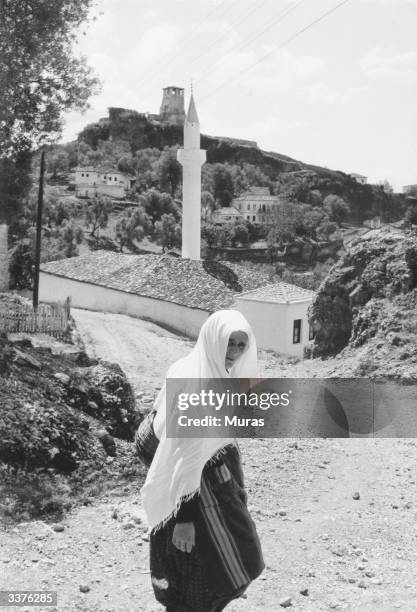 Muslim woman in local native attire in Albania. 70% of the population are Muslim, the rest being Greek Orthodox and Roman Catholic, all religious...