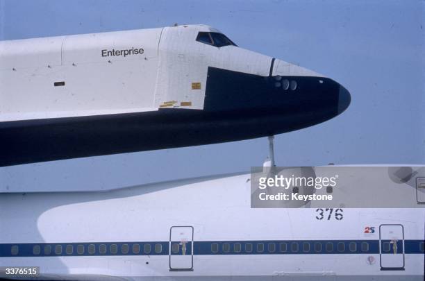 Space shuttle Enterprise on the back of a Jumbo jet, at Stansted Airport, England, during a tour of Europe.