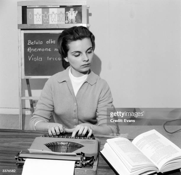 Girl Using Typewriter Girl Typing Photos and Premium High Res Pictures - Getty Images