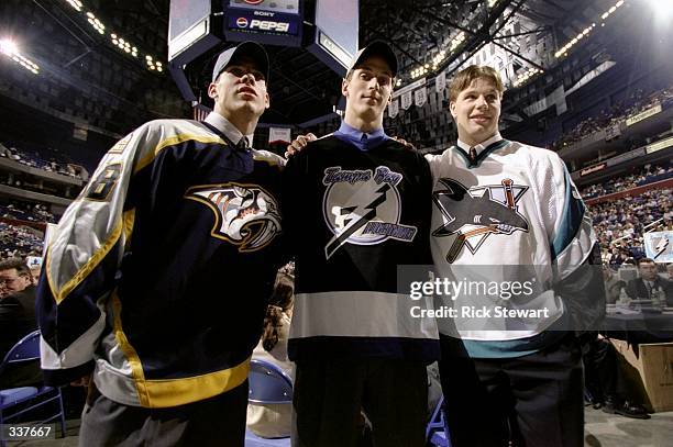 First round picks David Legwand of the Nashville Predators, Vincent Lecavalier of the Tampa Bay Lightning and Brad Stuart of the San Jose Sharks pose...