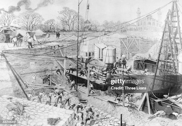 Workmen laying the foundations of the Eiffel Tower, Paris.