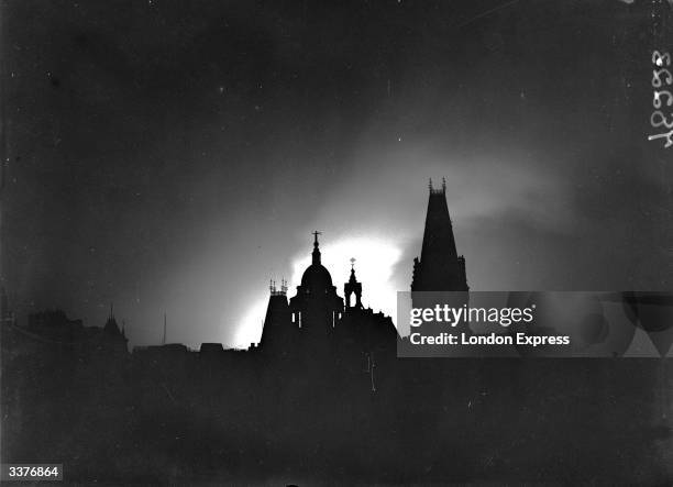 London skyline in the blitz silhouetted by the light of fires.