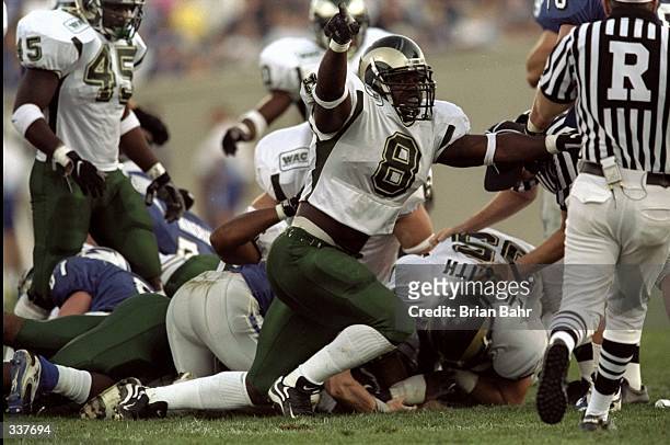Defensive lineman Joey Porter of the Colorado State Rams in action against fullback Spanky Gilliam of the Air Force Falcons during the game at the...