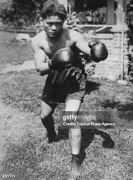 World flyweight boxing champion Pancho Villa of the Philippines in training.