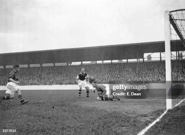 West Ham United goalkeeper, Weare, stops a shot from the on- rushing Plymouth Argyle forward, Connor, as West ham defender, Chalkley looks on.