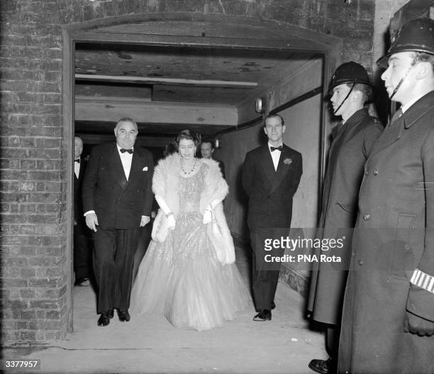 Princess Elizabeth and Prince Philip, Duke of Edinburgh arriving at the London Coliseum to attend a Gala Midnight Matinee in aid of the National...