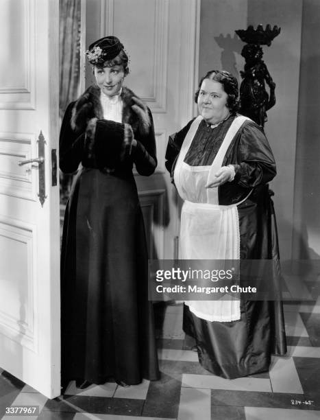 Austrian actress Luise Rainer stars in the MGM film 'Escapade', with Mathilde Caumonn as a maid.