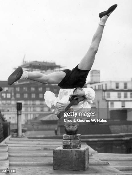 Jack's favourite instruments are the ukelele and the mouth organ, and he is currently thrilling audiences with his upside down antics at the Windmill...