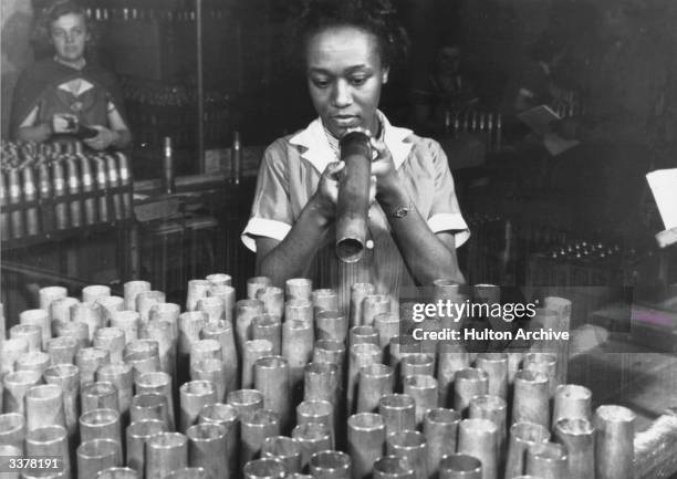 Black American war worker in a munitions factory.