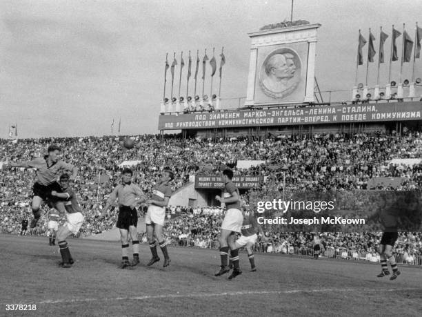 Wolverhampton Wanderers players , Roy Swinburne, Jimmy Mullen, and Dennis Wilshaw, attack the opposition's goal as Wolves play Spartak Moscow in...