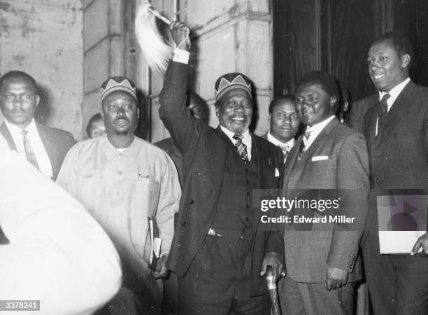 Kenyan Prime Minister Jomo Kenyatta arriving at talks in London to discuss the independence of Kenya. Left to right - Oginga Odinga , Jomo Kenyatta...