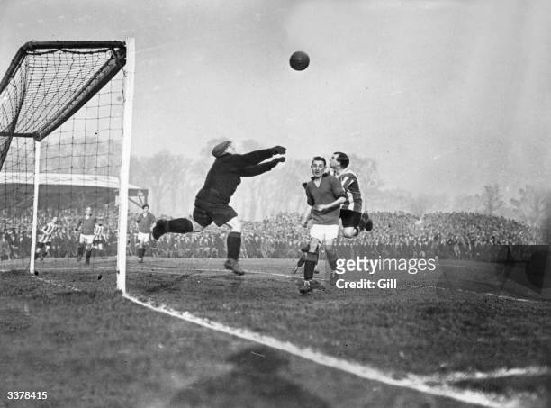 The goalkeeper comes out for the ball as Plymouth Argyle play Notts County in a first round FA Cup tie.
