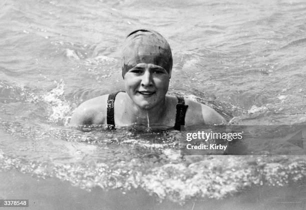 American Olympic gold medalist, swimmer Gertrude Ederle poses in the sea at Brighton, training for her cross English Channel swim, July 2, 1925.