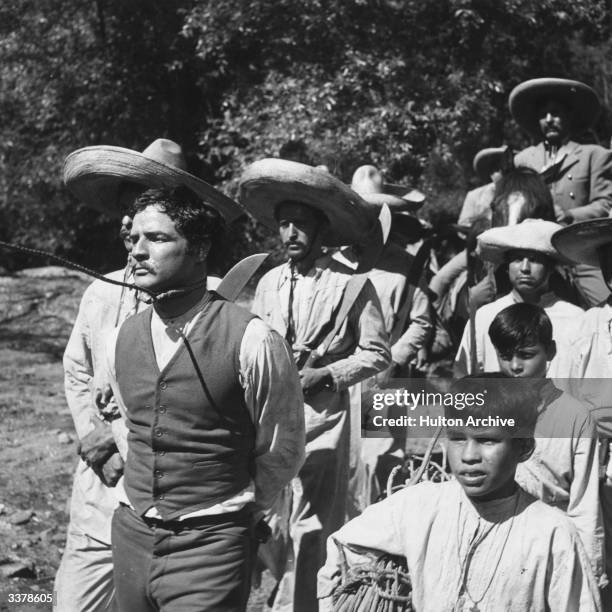 Marlon Brando starring as Mexican folk hero Emiliano Zapata is pulled by a noose around his neck in 'Viva Zapata!' directed by Elia Kazan for 20th...