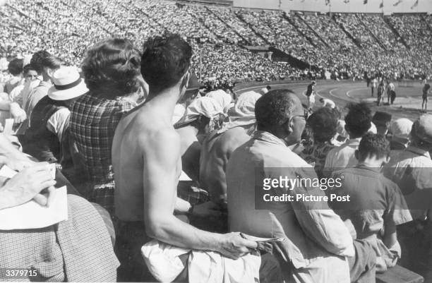 Crowds watching the 1948 London Olympics in the 90 degree heat at Wembley Stadium. Original Publication: Picture Post - 4582 - Olympic Games - pub....
