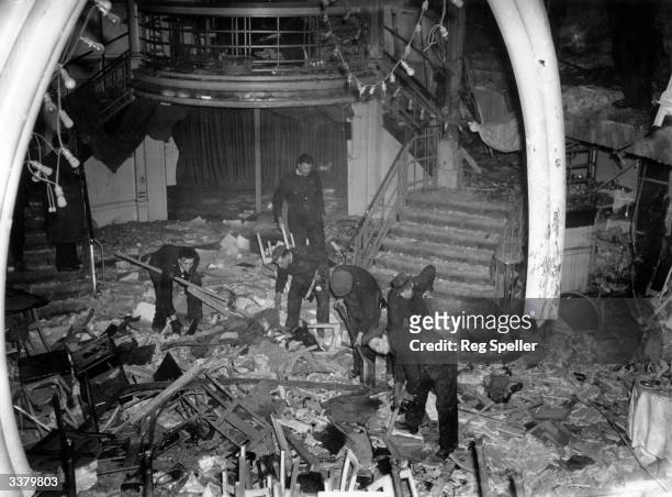 Emergency workers clear out the bomb-damaged interior of the Cafe de Paris in London, during World War II.