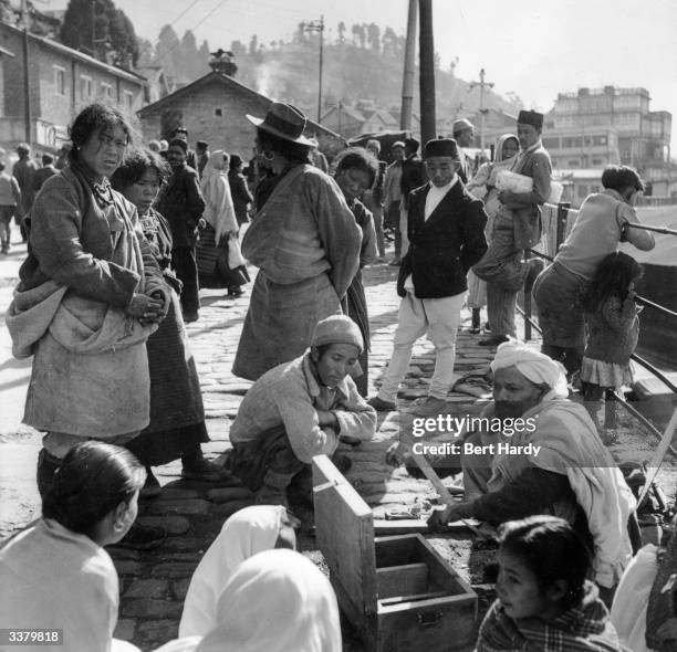 Traders and inhabitants of the Tibetan-Indian border, during the invasion of Tibet by the Communist forces of China. Original Publication: Picture...