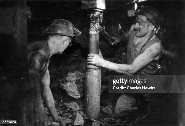 The new hydraulic pit prop being positioned in a mineshaft of Highley Colliery in Shropshire. Unlike the old timber or steel props, hydraulic props...