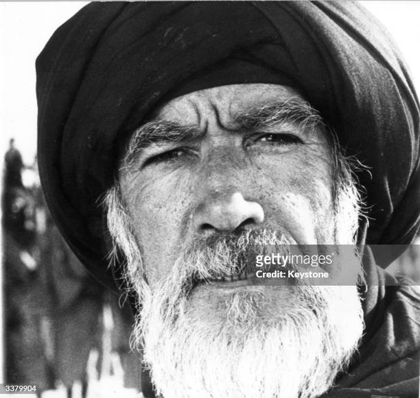 American actor, Anthony Quinn in costume as an early Islamic believer in a scene from 'The Message' a film documenting the birth of Islam shot on...