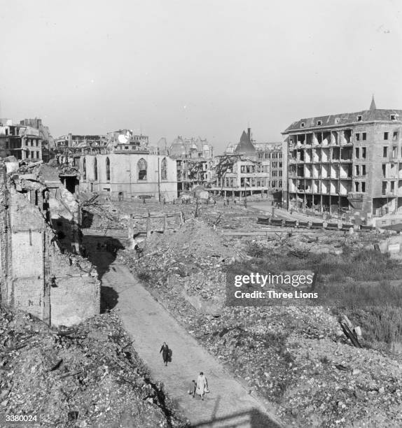 Ruined buildings in the centre of Essen, in the Ruhr. A road has been laid through the rubble for residents.