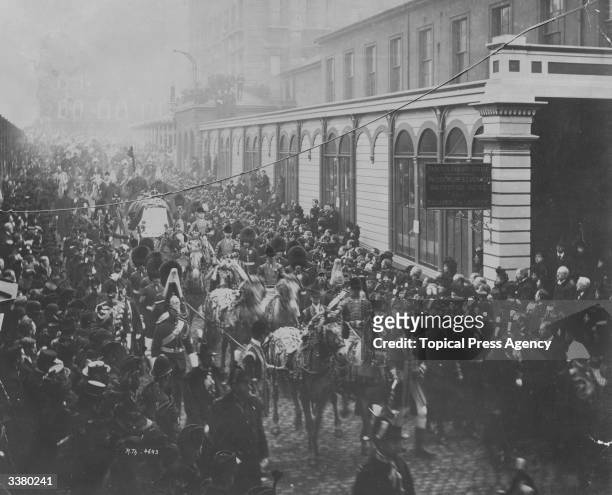 Crowds lining a London street as Queen Victoria's funeral cortege passes.