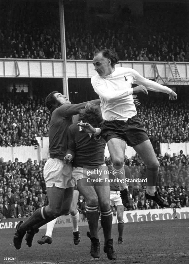 Tottenham Hotspur's Alan Gilzean challenges Leicester City's... News