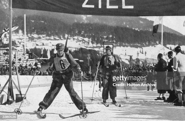The German biathlon team at the finishing post at the Winter Olympic Games at Garmisch-Partenkirchen.