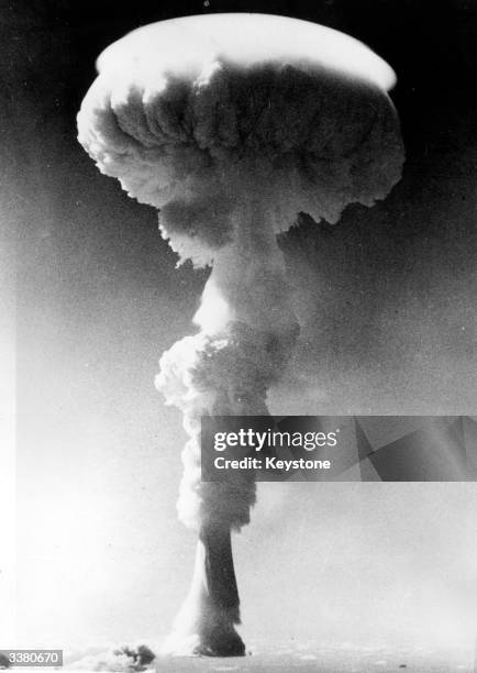 Mushroom cloud rises over the Pacific Ocean following the detonation of Britain's first H-bomb near Christmas Island .