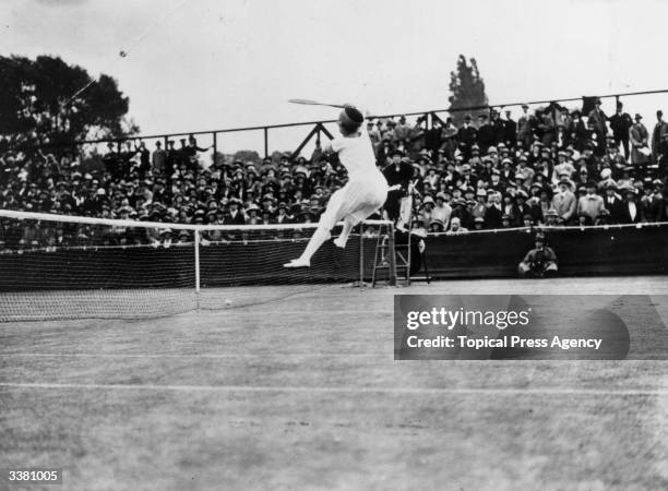 French tennis player Suzanne Lenglen competing in the women's singles tournament at Wimbledon which she went on to win.