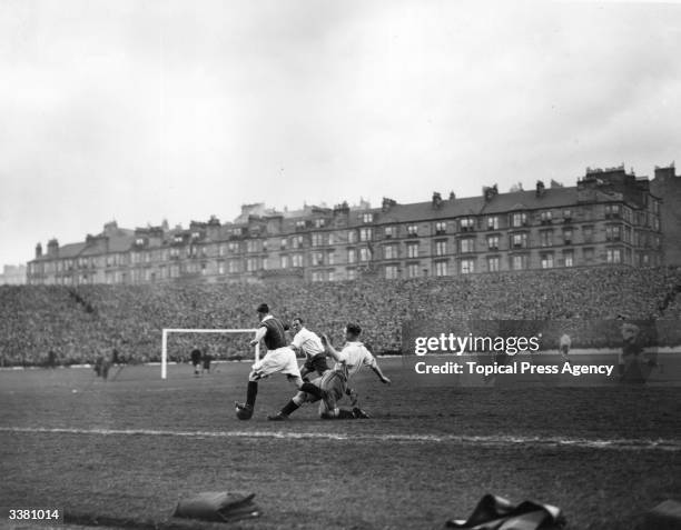 Morgan , of Scotland, evades a tackle from England's Kean, during an international match in Glasgow.