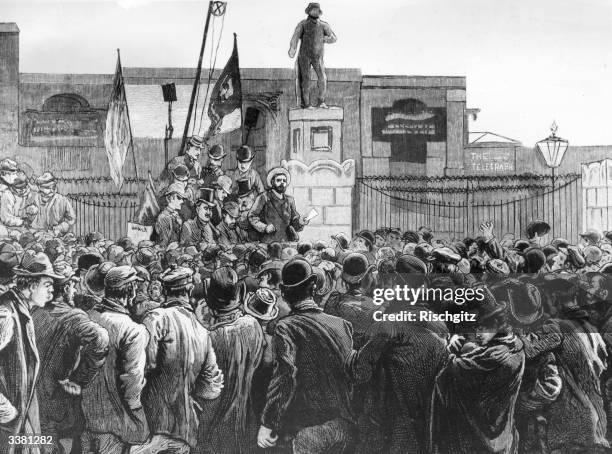British trade unionist John Burns addressing a group of London dockers who are on strike at the gates of the East and West India Docks. Original...