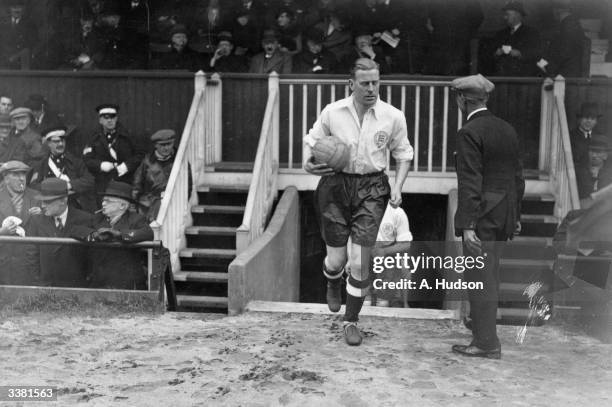 Amateur International England v Scotland at Dulwich Hamlet FC ground, Champion Hill, London. England team captain Bernard Joy leading his team out.