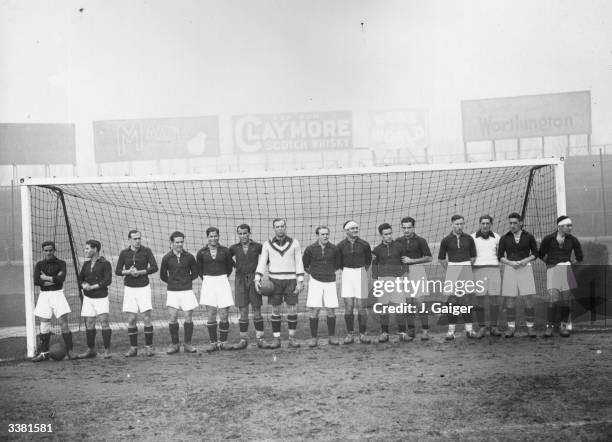 The Spanish national football team pose in the goalmouth at Stamford Bridge during a visit to Britain.