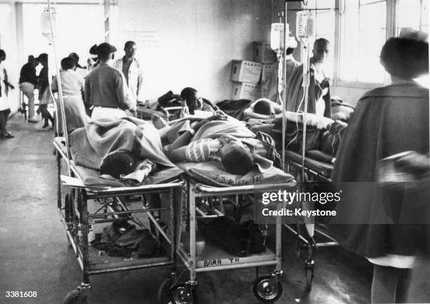 Injured people waiting for treatment after a riot in Soweto, outside Johannesburg, South Africa. The rioting started after police opened fire on a...