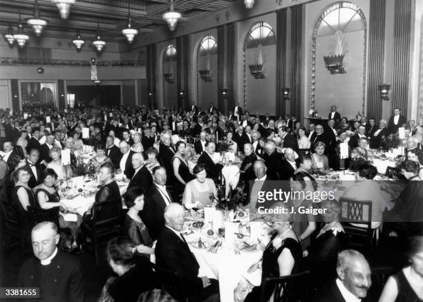 Guests at the anniversary dinner of the English-Speaking Union at the Cafe Royal, London. They are listening to a speech by jurist and statesman...