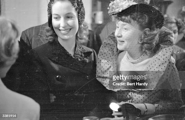 Actress Valerie Hobson and Dulcie Gray at the Screenwriters' Club in London. Original Publication: Picture Post - 4586 - Guest Night At The...