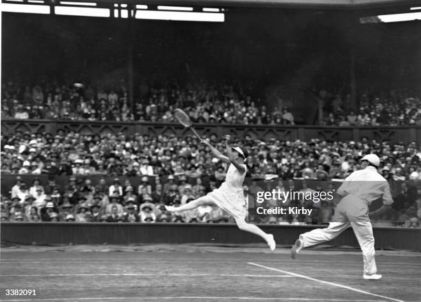 Tennis partners Evelyn Colyer and P D Spence in action during their mixed doubles match against Bela von Kehrling and Lili de Alvarez at the...