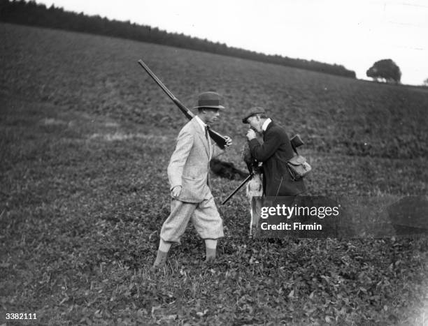 King George VI taking part in a shooting party led by Lord Pembroke at Wilton, Salisbury.